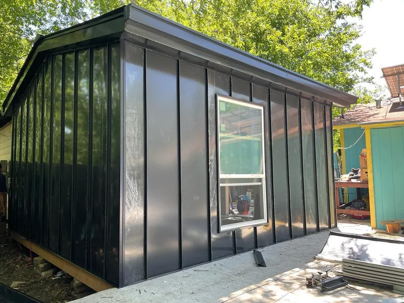 Black standing seam metal wall panels for Roof Inspection in Snohomish