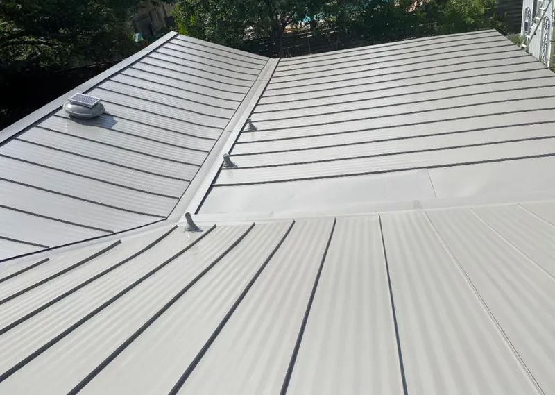 Solar attic fan installed on a metal roof for Roof Ventilation in Snohomish